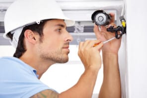 Employee Installing Video Surveillance Systems