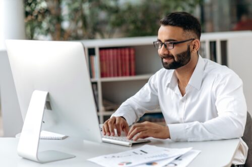 professional working on computer in office